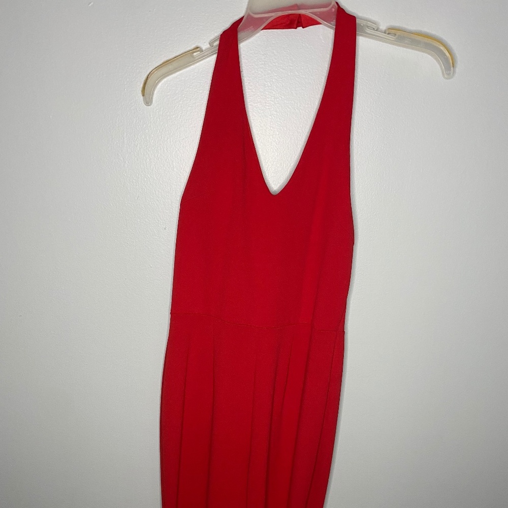 Red flared-leg halter-neck romper